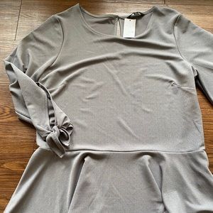 Peplum dressy blouse, 3/4 length sleeve with a tie